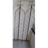 A brown painted metal three-fold garden trellis 68''h BSR