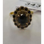 An 18ct gold bi-coloured gold sapphire and diamond set cluster ring 11