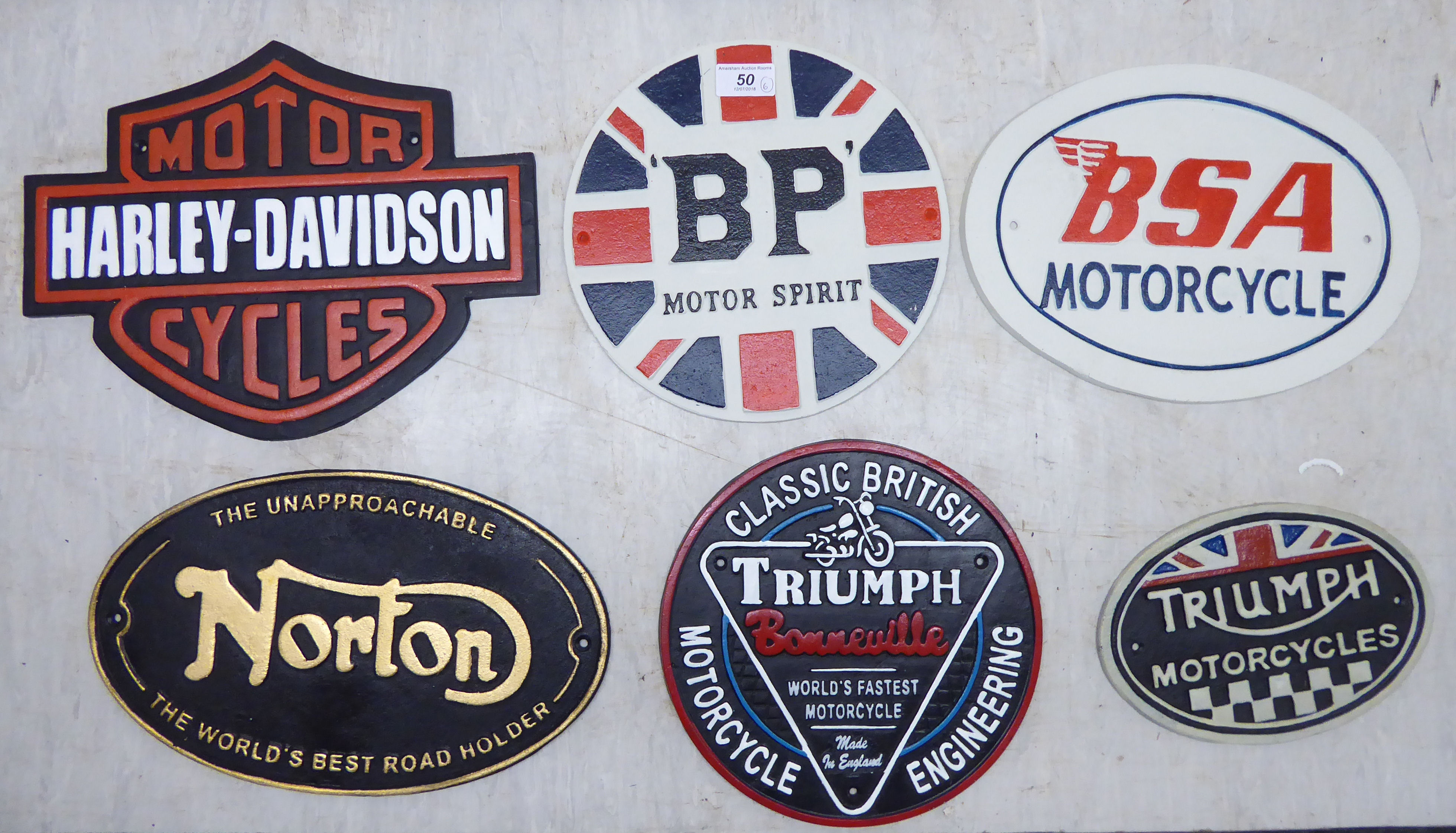 Six cast iron signs, viz.