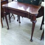 A George III mahogany tea table, the foldover top having turreted corners,