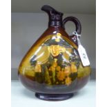 A Royal Doulton Dewars china whisky flask with a strap handle, narrow neck and pouring lip,