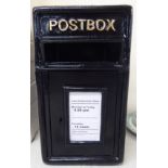 A black painted cast iron postbox with a single door 18''h 9''w BSR