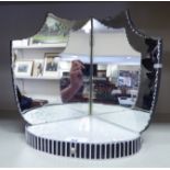 A mid 20thC mirror mounted, wooden, bow front display stand 10''h 8.