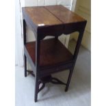 A George III mahogany two tier night table with a single drawer,