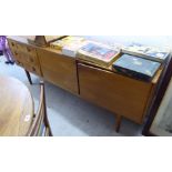 A 1970s McIntosh & Co teak sideboard with three drawers and a pair of doors,