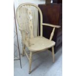 A late 19thC cream painted beech and elm framed elbow chair, the hoop,