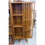 A 20thC (possibly American) hardwood three tier revolving bookcase,