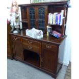 An Edwardian mahogany dresser, the superstructure with a pair of lead glazed doors,