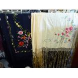 Two Edwardian floral embroidered shawls, one on a black ground,