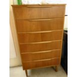 A 1970s teak six drawer tallboy, raised on square,