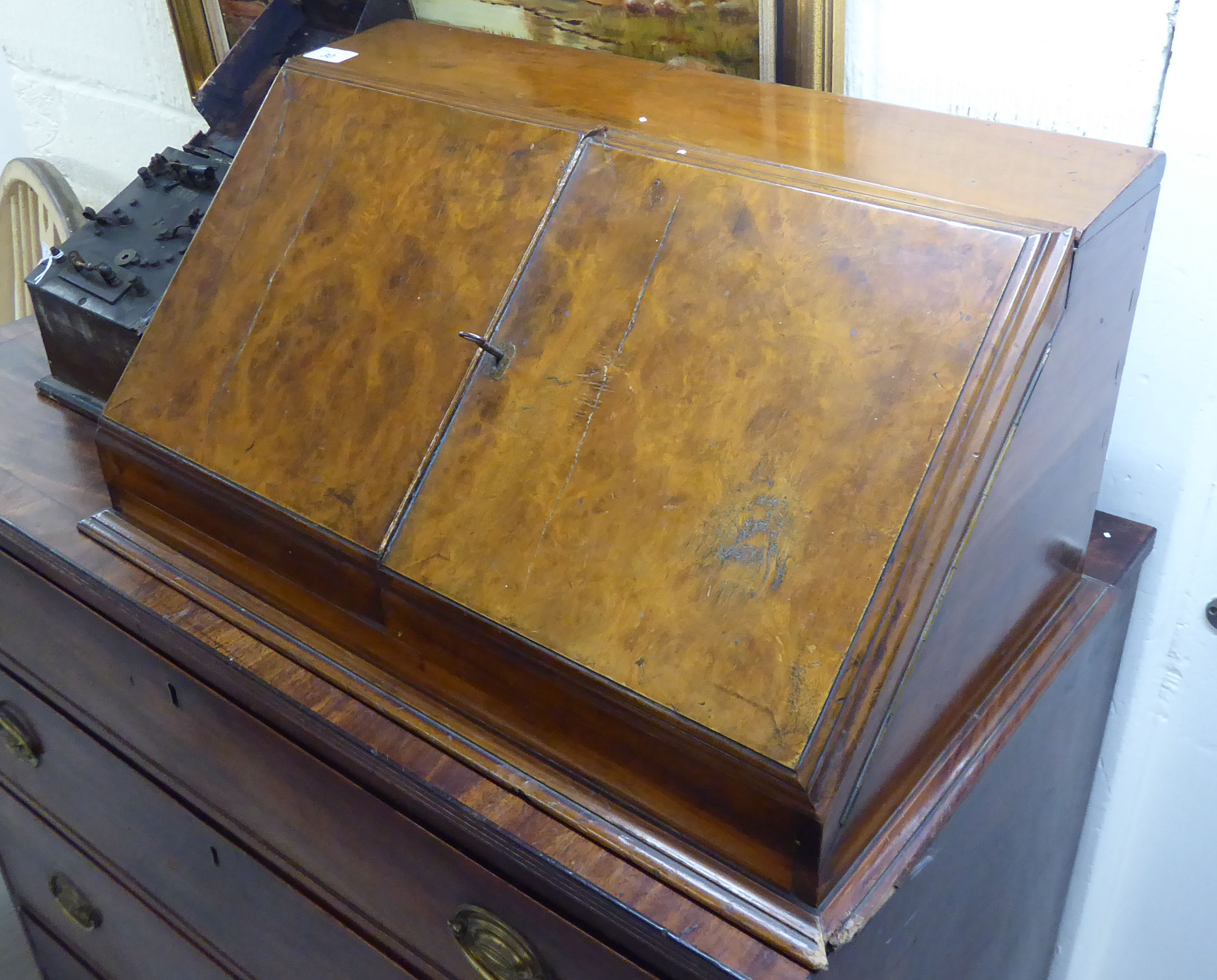 A late Victorian burr walnut and mahogany desktop stationary box with a pair of angled doors,