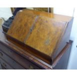 A late Victorian burr walnut and mahogany desktop stationary box with a pair of angled doors,