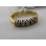 An 18ct gold five stone half eternity ring 11