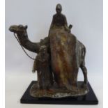 A 1920s painted spelter novelty table lighter, fashioned as two Arab carpet sellers,