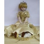 A late 19thC wax head doll with fixed glass eyes,