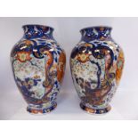 A pair of late 19thC Japanese Satsuma porcelain baluster shaped vases,