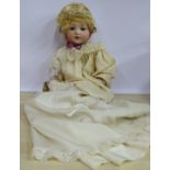 An early 20thC Armand Marseille bisque head doll with painted features and fixed eyes,