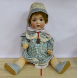 An early 20thC Armand Marseille bisque head doll with painted features and weighted sleeping eyes,
