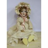 An early 20thC Armand Marseille bisque head doll with painted features and weighted sleeping eyes,