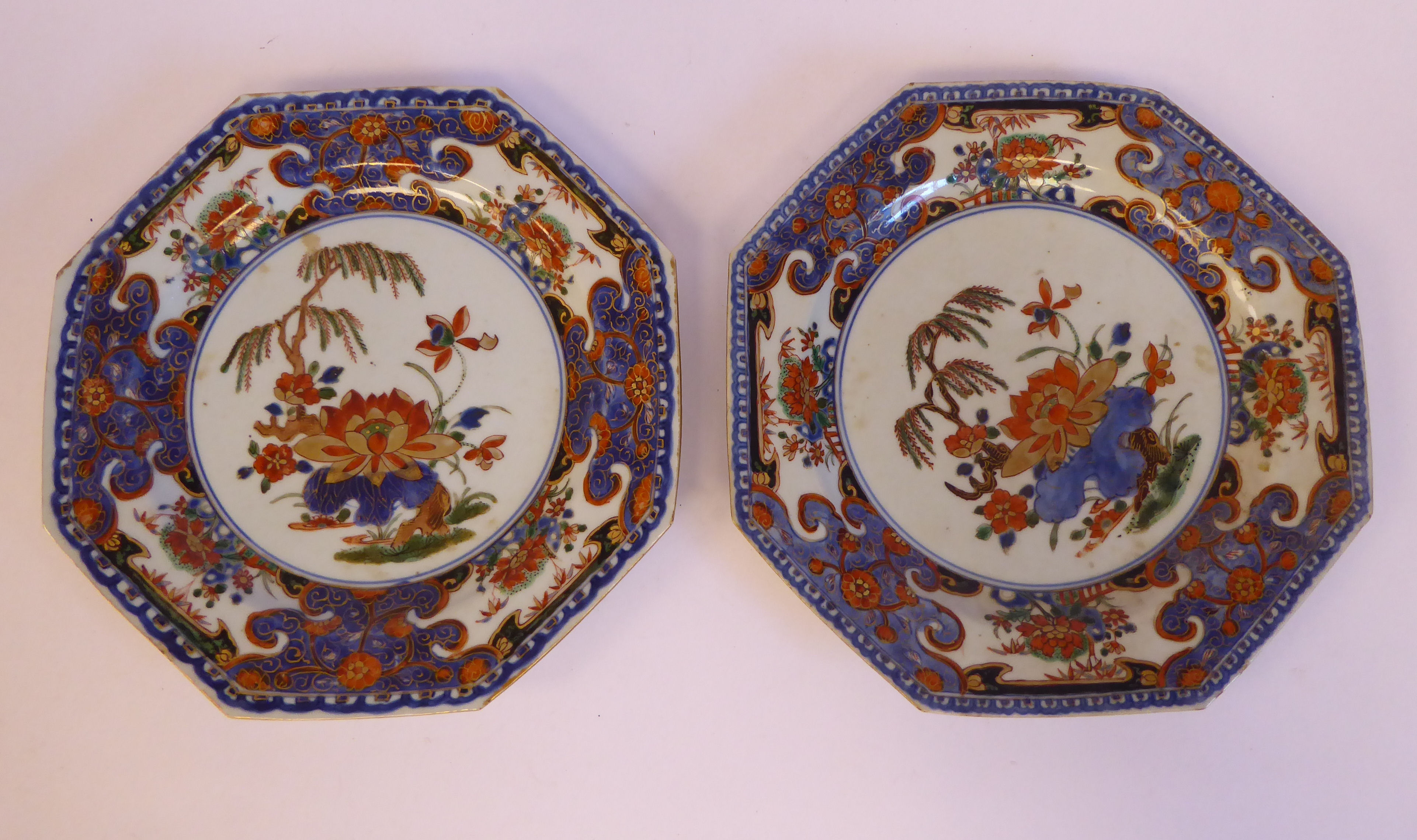 A pair of late 19thC Chinese porcelain octagonal plates, decorated in colours with lotus flowers,