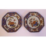 A pair of late 19thC Chinese porcelain octagonal plates, decorated in colours with lotus flowers,