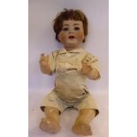 A Simon & Halbig bisque head doll with painted features and sleepy eyes,