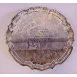 A Georgian style silver salver with a raised piecrust border,