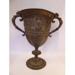 A mid Victorian silver trophy cup of oval, lobed form,