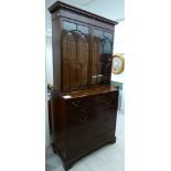 An early 19thC mahogany secretaire bookcase,