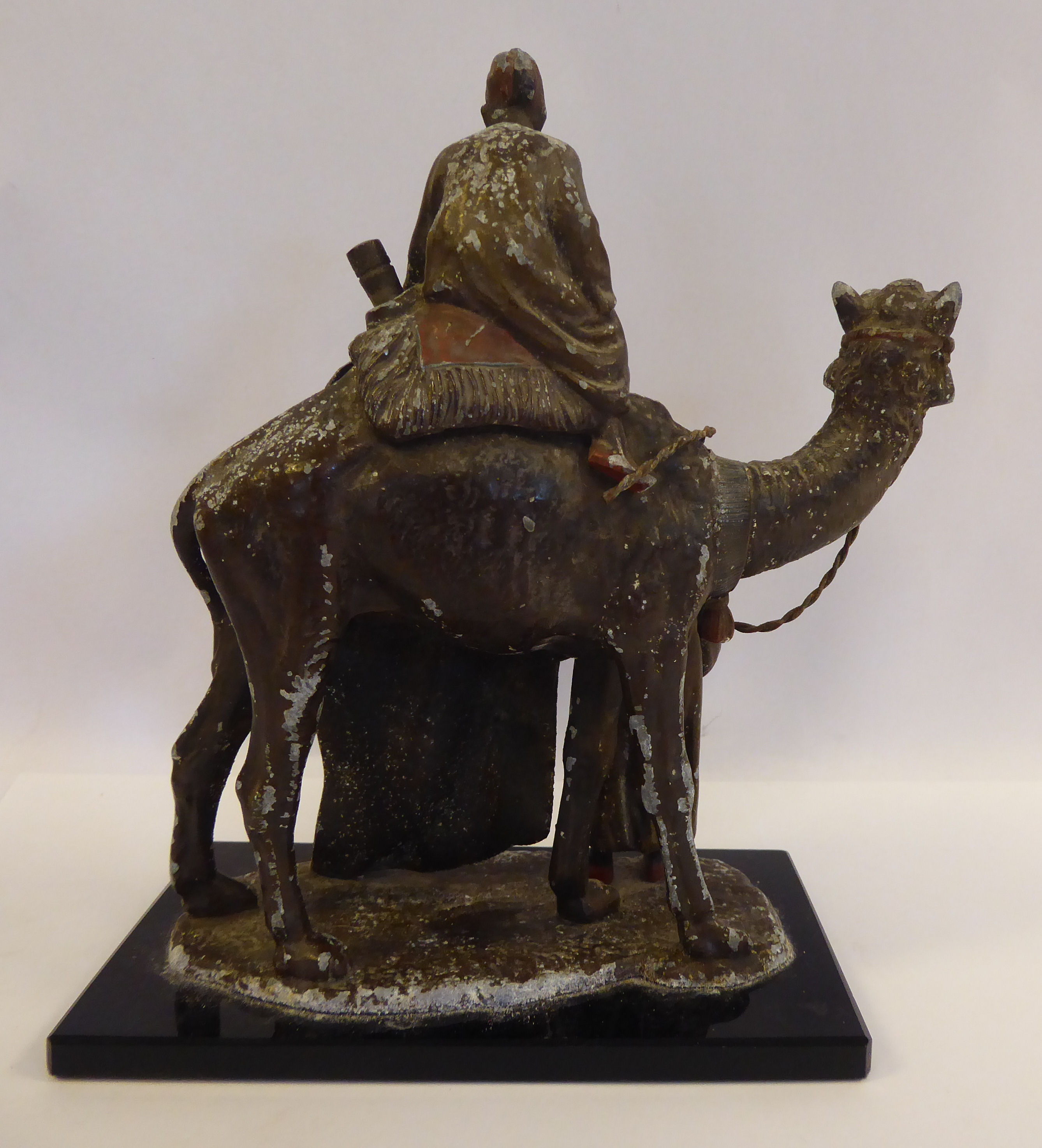 A 1920s painted spelter novelty table lighter, fashioned as two Arab carpet sellers, - Image 3 of 7
