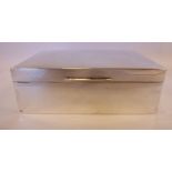 An Edwardian silver cigarette box with straight sides,