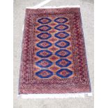 A Bokhara rug with two columns of seven guls,