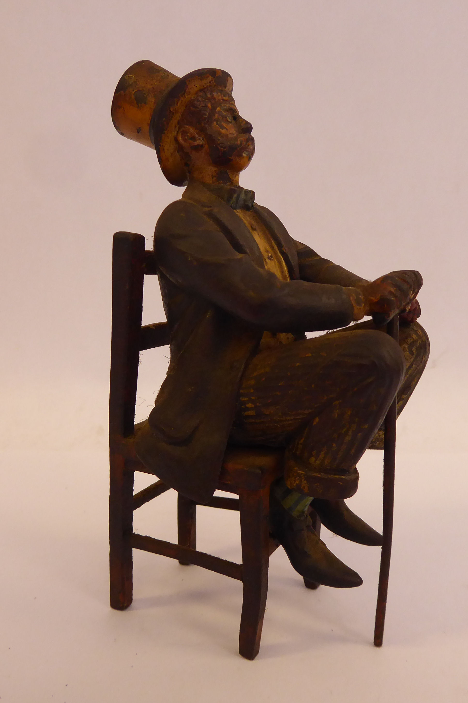 A late 19thC painted cold cast bronze figure, a bewhiskered gentleman, wearing a to hat and bow tie, - Image 5 of 5