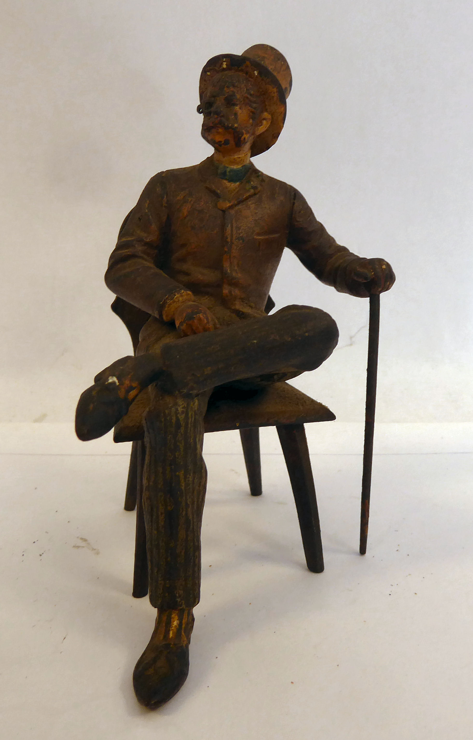 A late 19thC painted cold cast bronze figure, a bewhiskered gentleman,