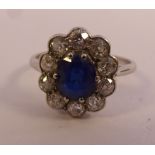A platinum oval cluster ring,