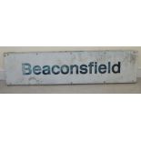 A painted metal railway sign,
