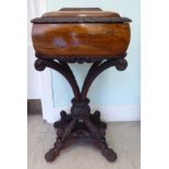 A mid 19thC Colonial rosewood teapoy, the casket with a foliate and radiating reed carved, domed,