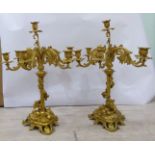 A pair of 19thC style gilt metal candelabra,