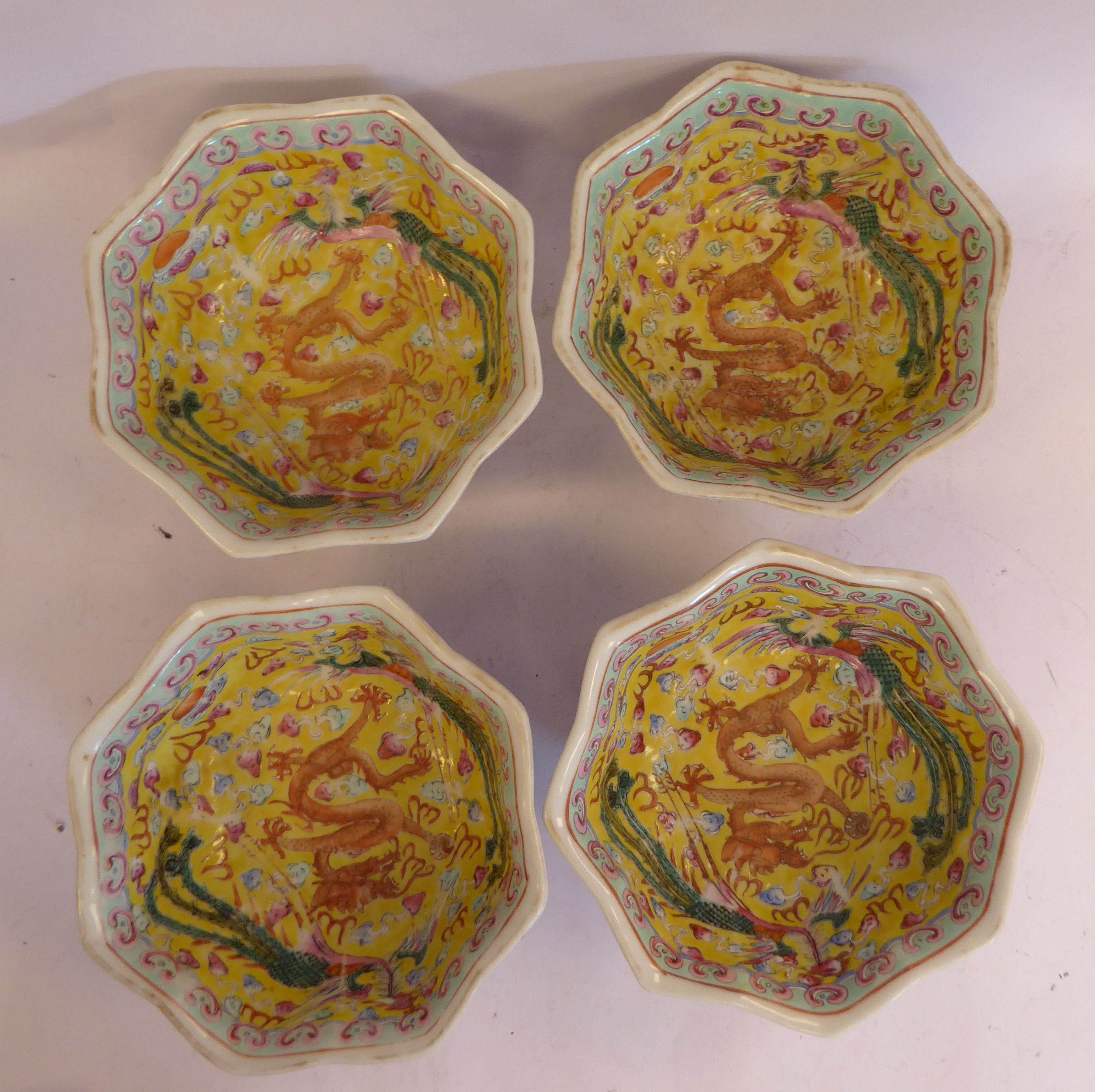 A set of four late 19thC Chinese porcelain octagonal bowls, on splayed footrims,
