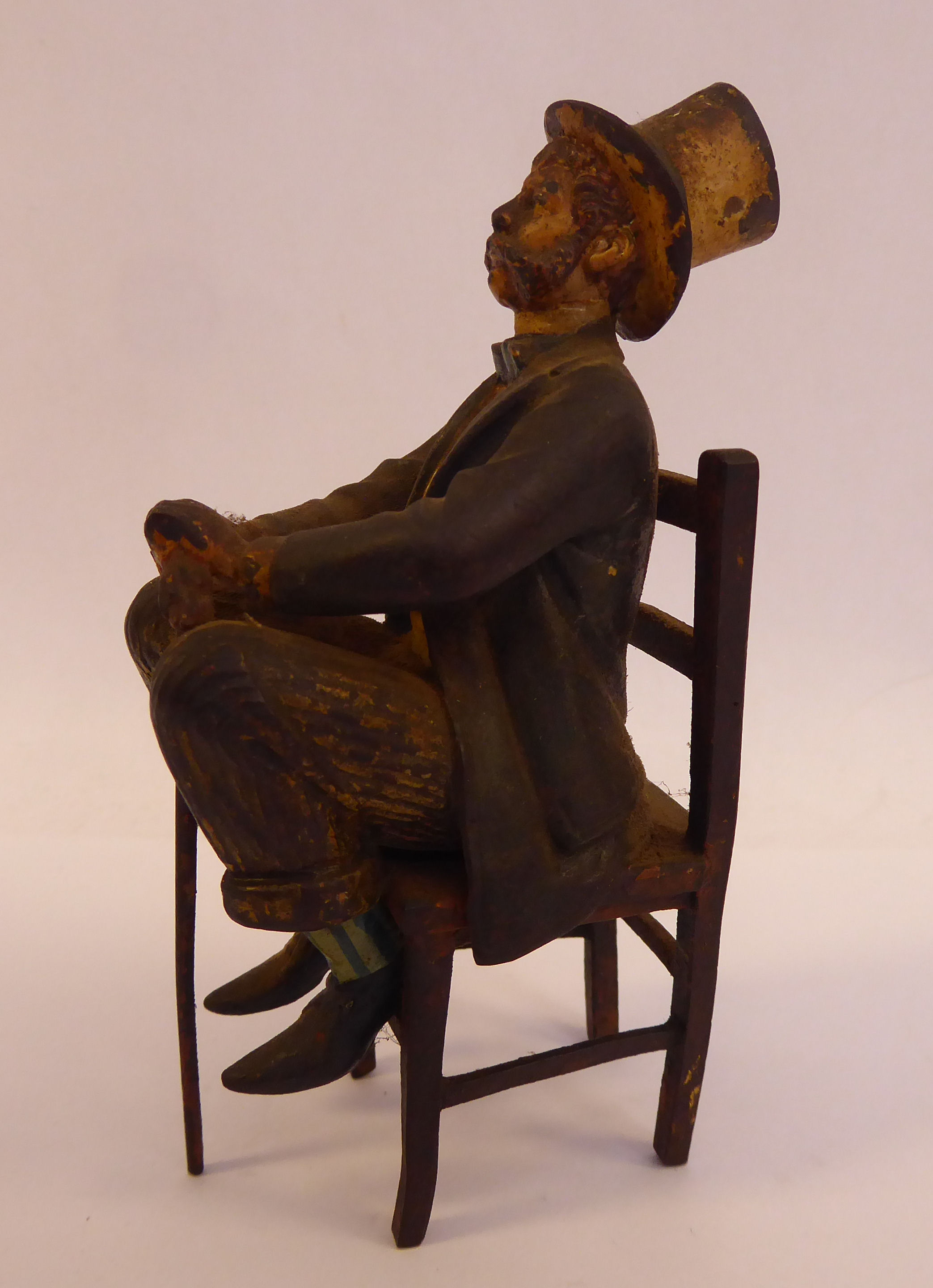 A late 19thC painted cold cast bronze figure, a bewhiskered gentleman, wearing a to hat and bow tie, - Image 2 of 5