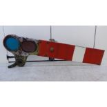 A railway red and white banded metal signal arm with one red and one blue window 63''L overall