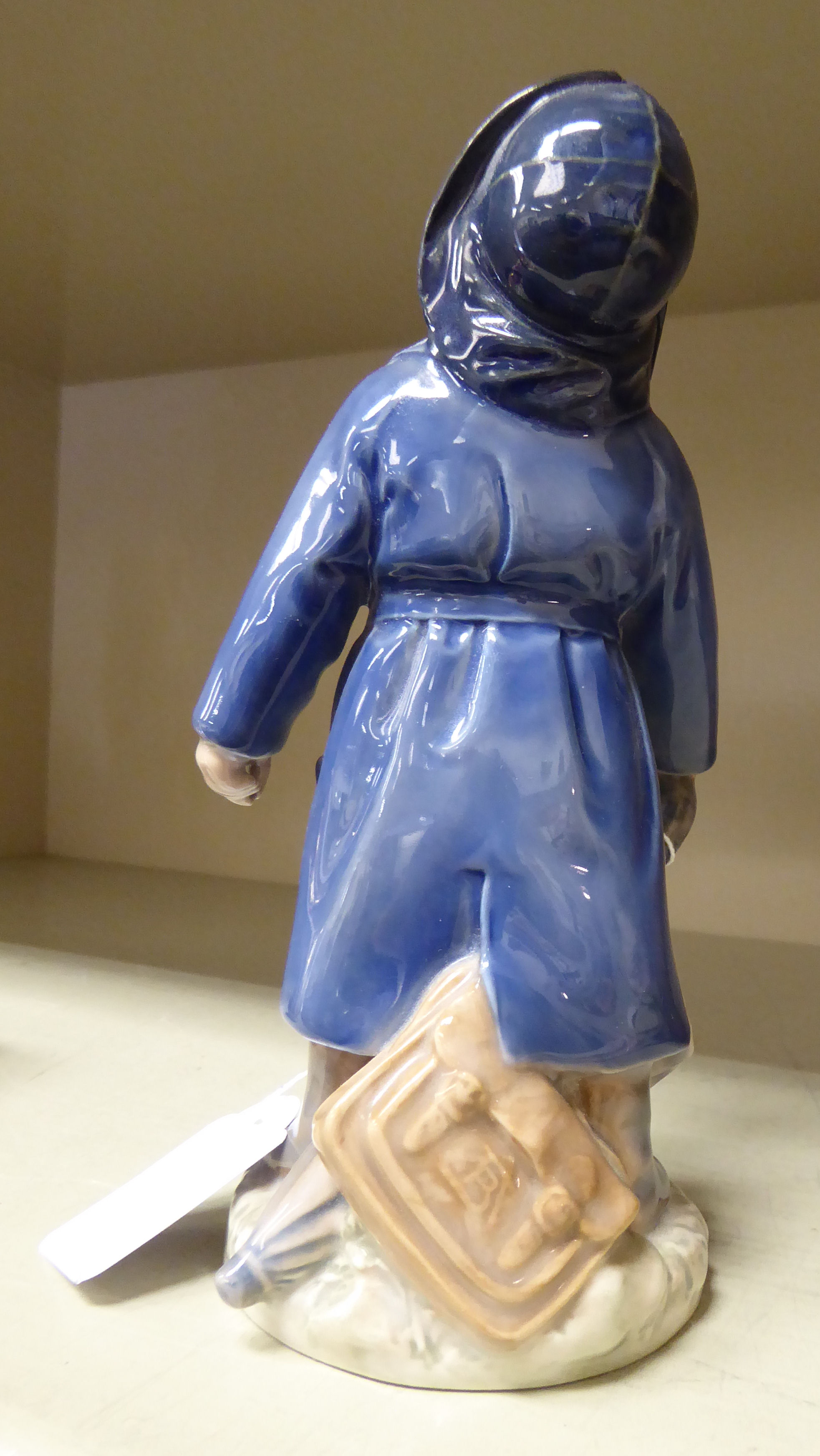 A Royal Copenhagen porcelain figure, a boy wearing a blue raincoat, holding an umbrella, model no. - Image 2 of 3