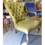 A Victorian style low, spoonback chair, stud and part button upholstered in olive coloured hide,