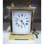 A mid 20thC Schultis Schwar & Co lacquered brass cased carriage timepiece with bevelled glass