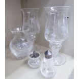 A pair of two part cut and engraved crystal table candlelights with bell design shades 9.