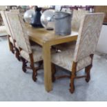 A modern light oak and beech refectory table, the planked top raised on square,