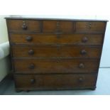 A George III oak dressing chest with three short/four long drawers,