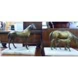 A pair of bronze finished metal equestrian models, a horse with a foal and a standing stallion,