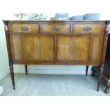 A Maple reproduction of a George III crossbanded mahogany sideboard with three frieze drawers,