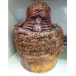 A carved and stained bamboo novelty doorstop,